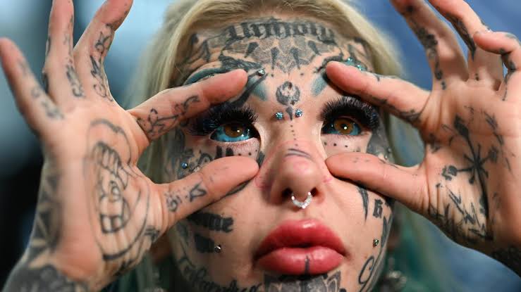 Most tattooed woman flies across the world for 