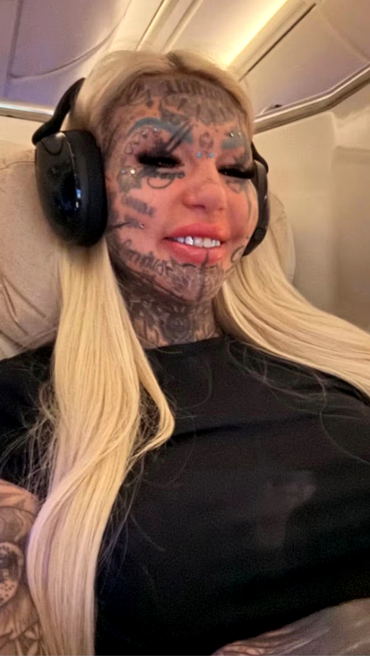 Most tattooed woman flies across the world for 