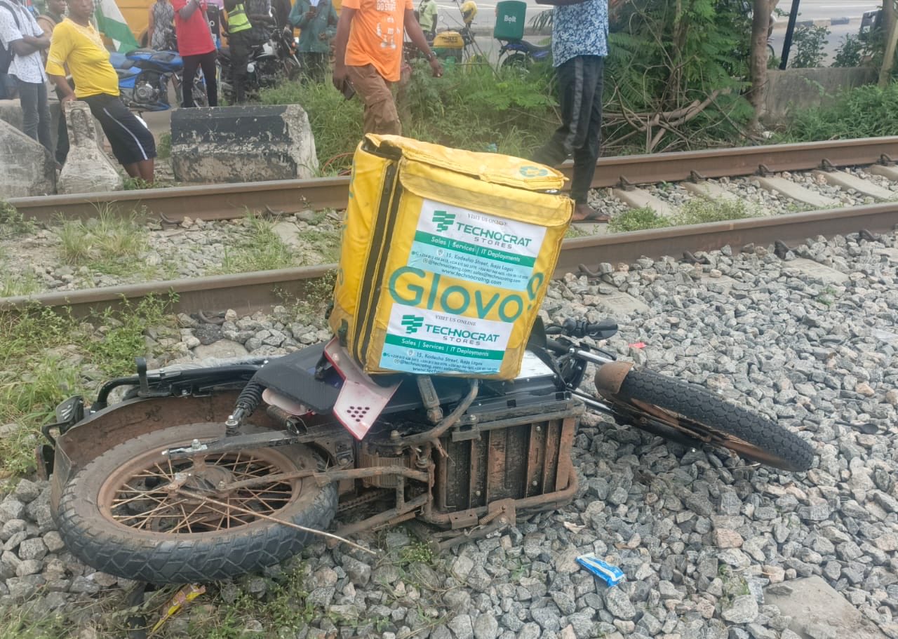 Train crushes dispatch rider to de@th in Lagos (photos)