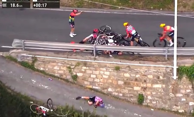 Horrific accident at the womenâs bicycle race as several riders collide with one competitor flying through the air and getting knocked unconscious (video)