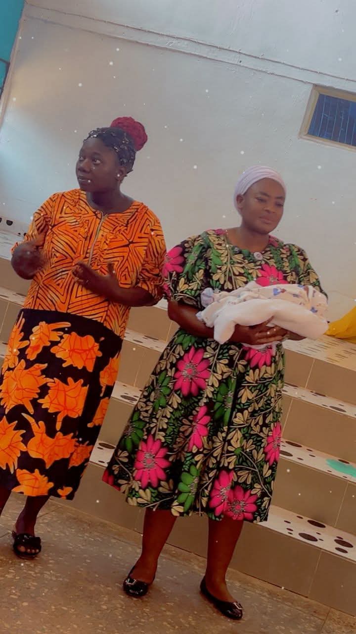 Husband holding newborn son after five years of marriage