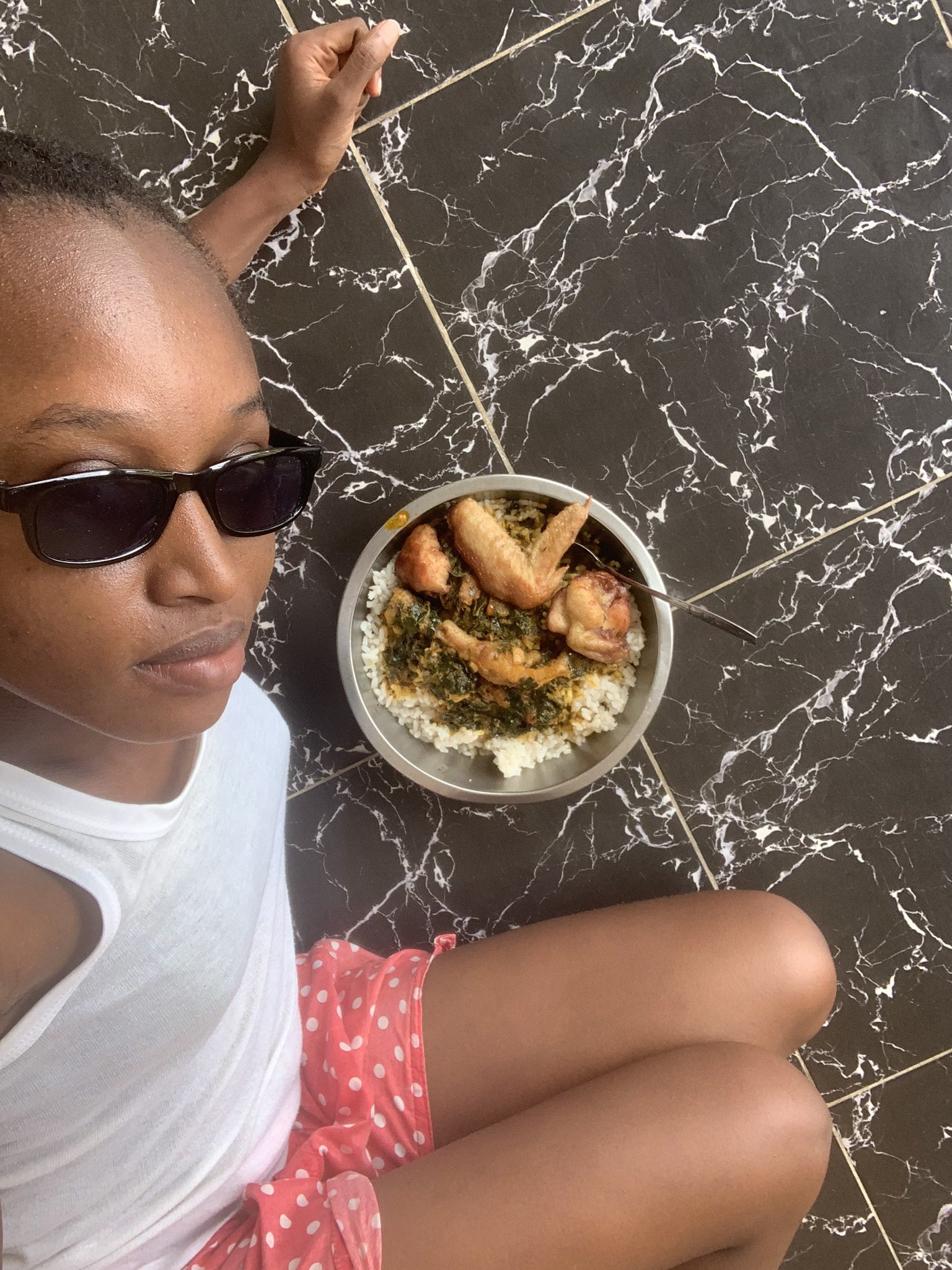 A Nigerian lady, TseTse, who has moved back in with her parents.