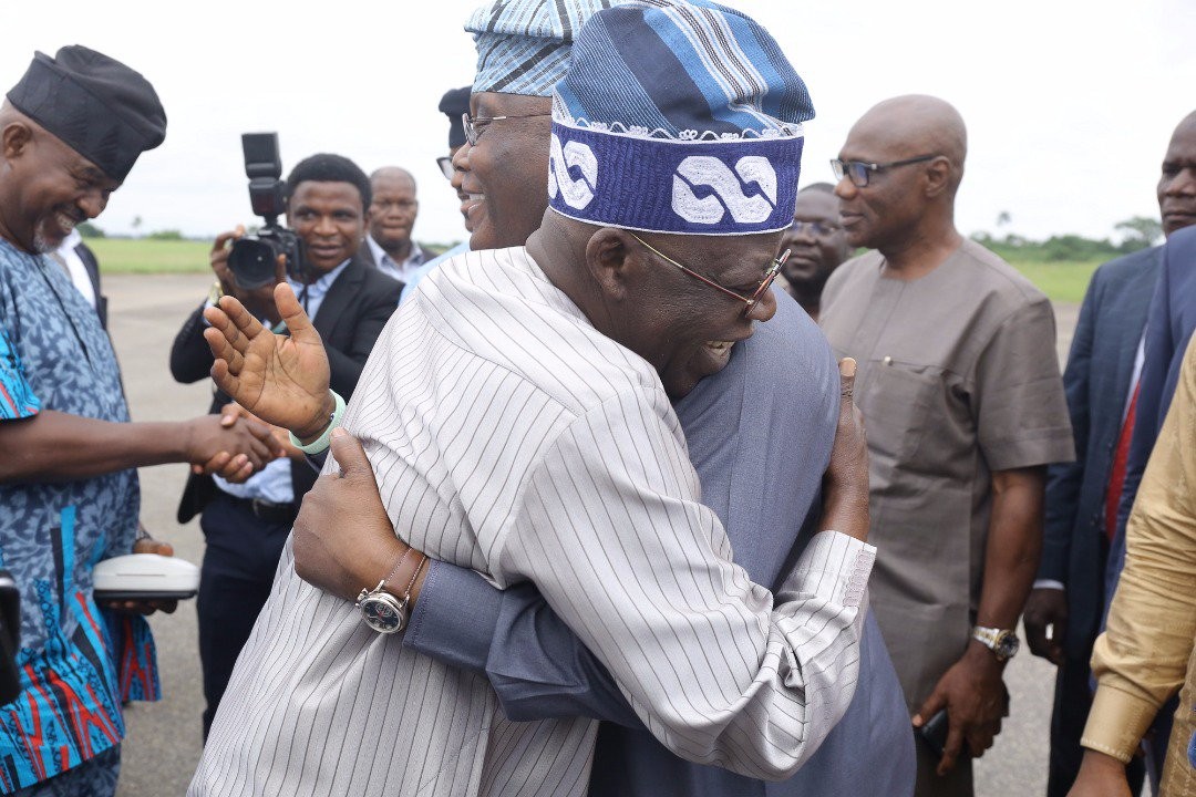 Photos: Tinubu, Atiku hug themselves at Akure airport
