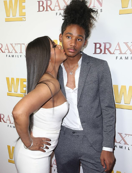 Toni Braxton plants a sweet kiss on her son Diezel, 16, as they step out  together