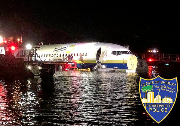 No lives lost as military plane carrying 143 people skids off the runway and crashes into a river while landing at Jacksonville airport