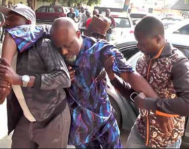 Senator Dino Melaye unable to 'stand' at the resumed hearing of his criminal trial