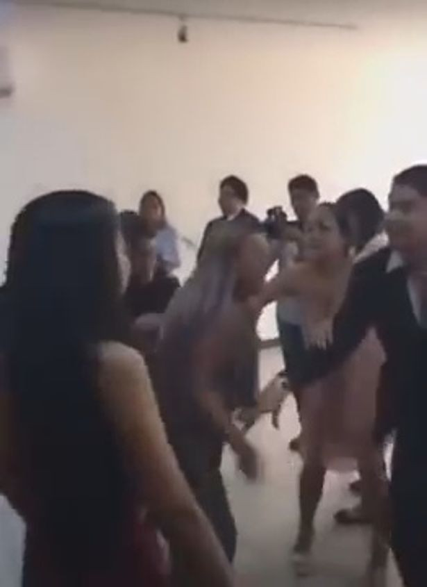 Wedding dissolves into chaos as woman crashes the event to tell groom 'I love you' before slapping the bride
