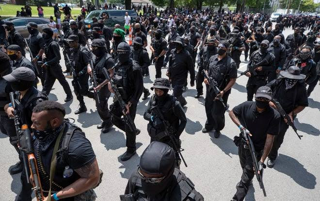 All black group called 'Not F**king Around Coalition' stage protests heavily armed as they demand justice for Black men killed by police in US (photos)