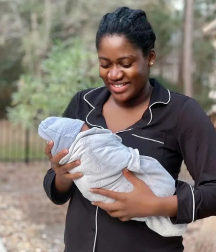 Adorable photo of reality TV star, Tobi Bakre's wife and their baby boy