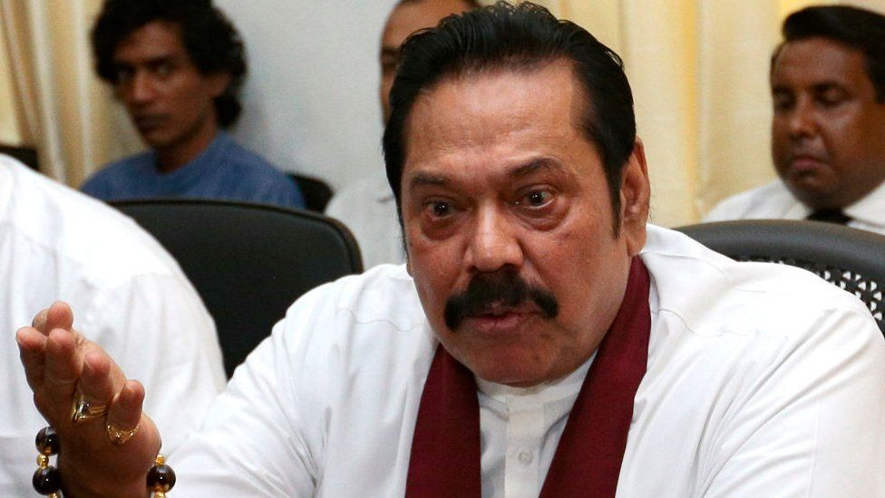 Military rescues outgoing Sri Lanka's Prime Minister after protesters attacked his home hours after his resignation