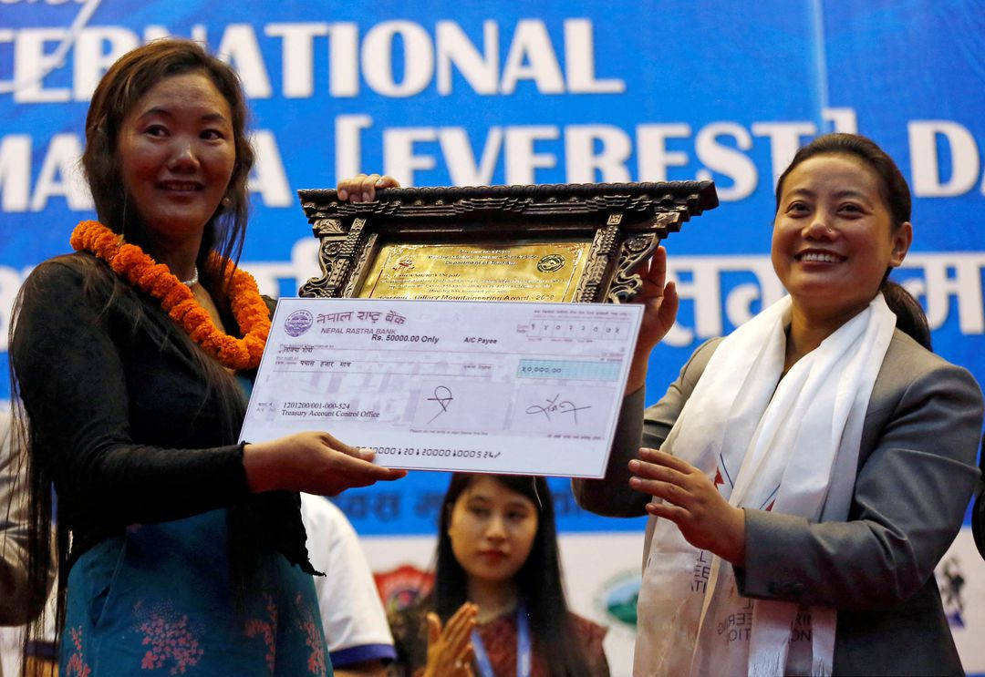 Woman from Nepal climbs Mountain Everest for record tenth time, breaking her own record