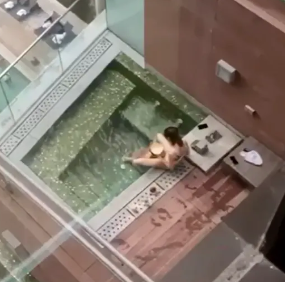 Randy couple caught having intercourse in hotel jacuzzi just feet from other guests