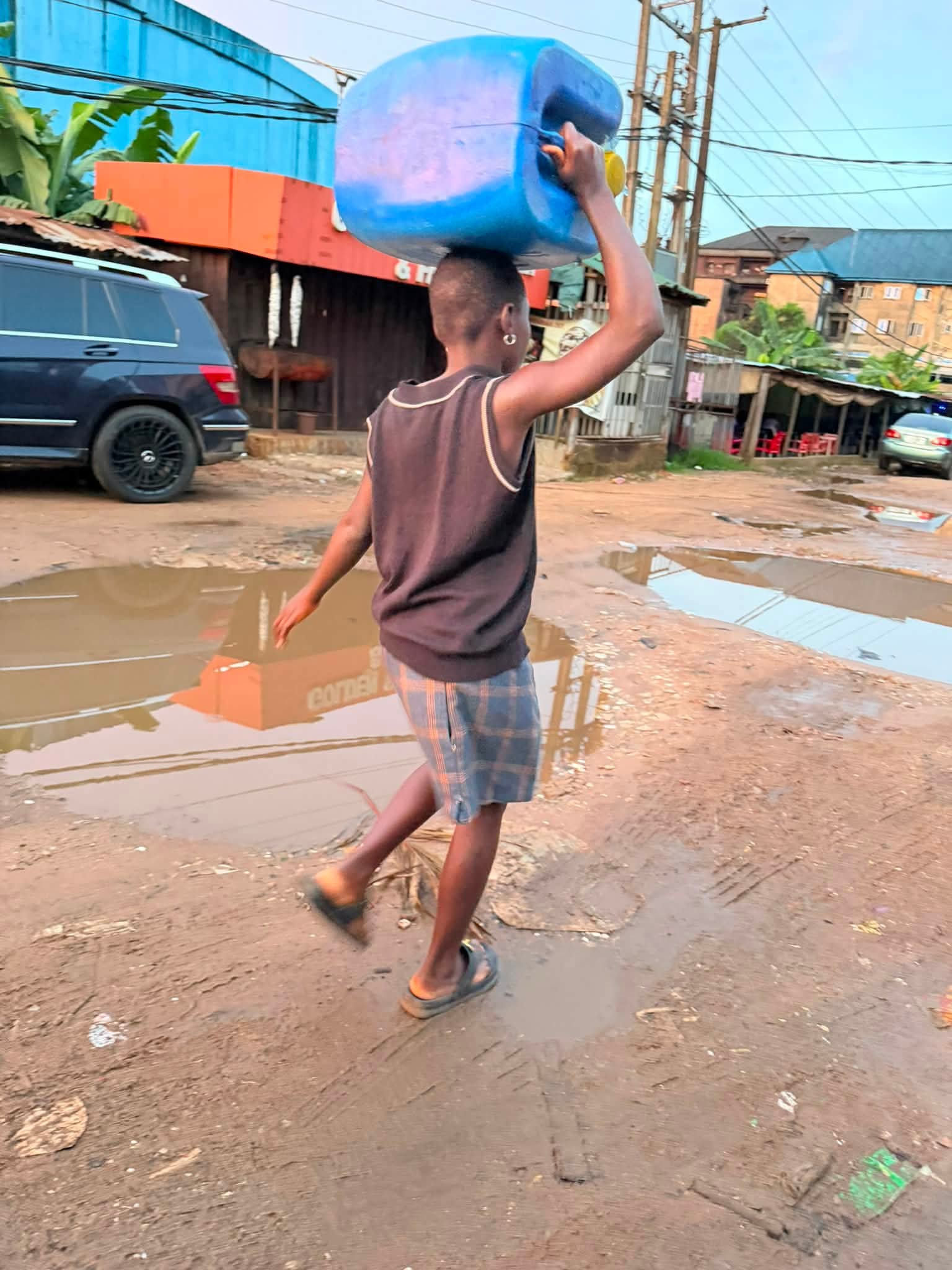 Nigerian woman expresses concern after watching a girl carry heavy gallon of water up to 3rd floor of building