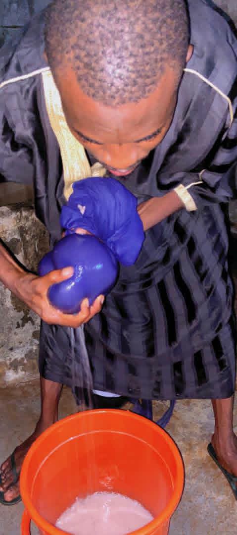Our wives are not our slaves. Help them - Nigerian man says as he prepares raw pap while his wife slept