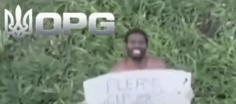 Shocking moment Russian mercenary holds up sign pleading for help as Ukrainian drone closes in on him
