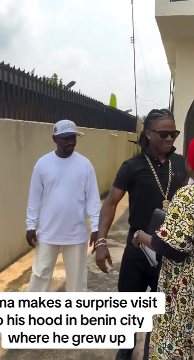 Singer Rema pays surprise visit to Benin neighbourhood he grew up in