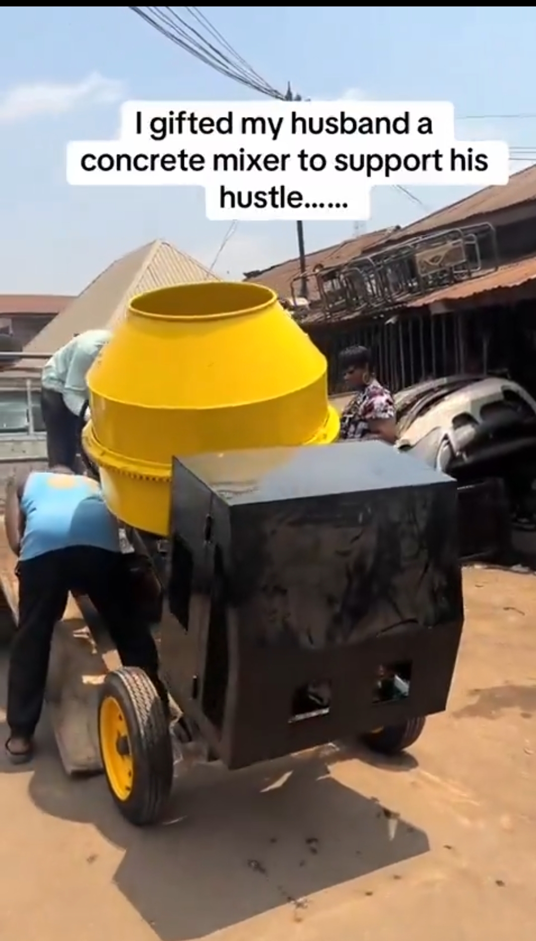 Wife surprises her husband, a building engineer, with brand new concrete mixer as gift