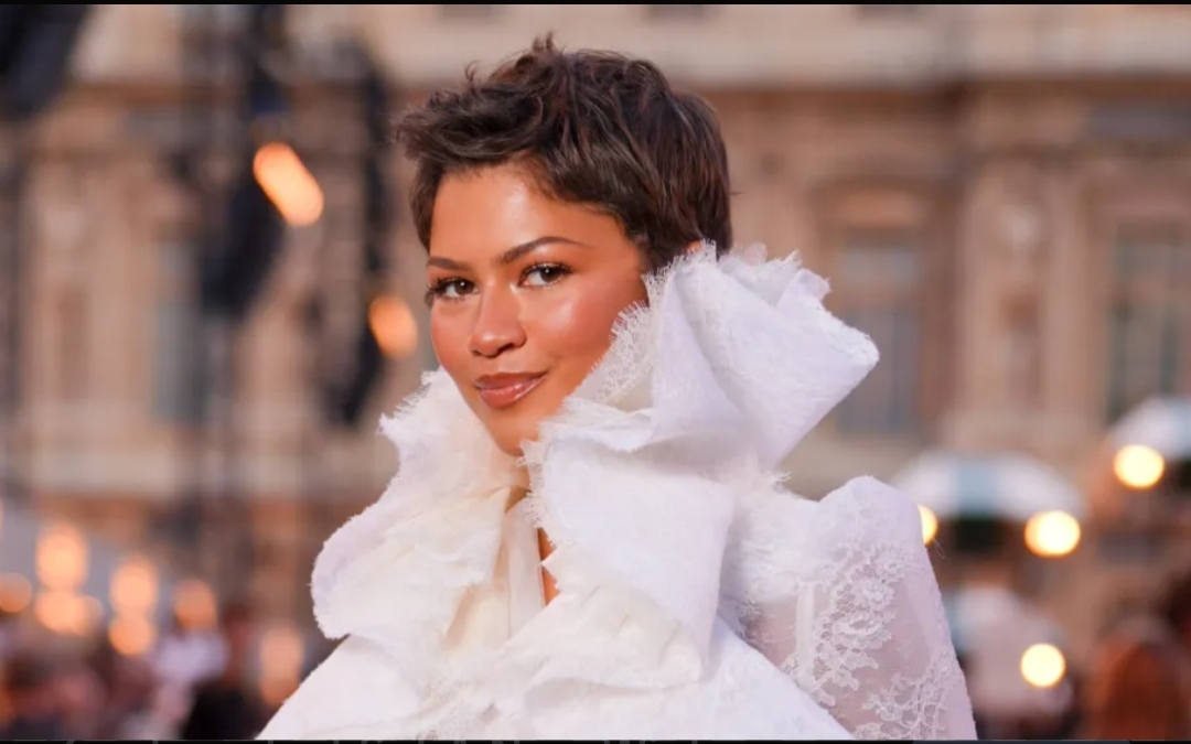 American actress Zendaya criticised for remaining seated while greeting Brigitte Macron at Louis Vuitton show