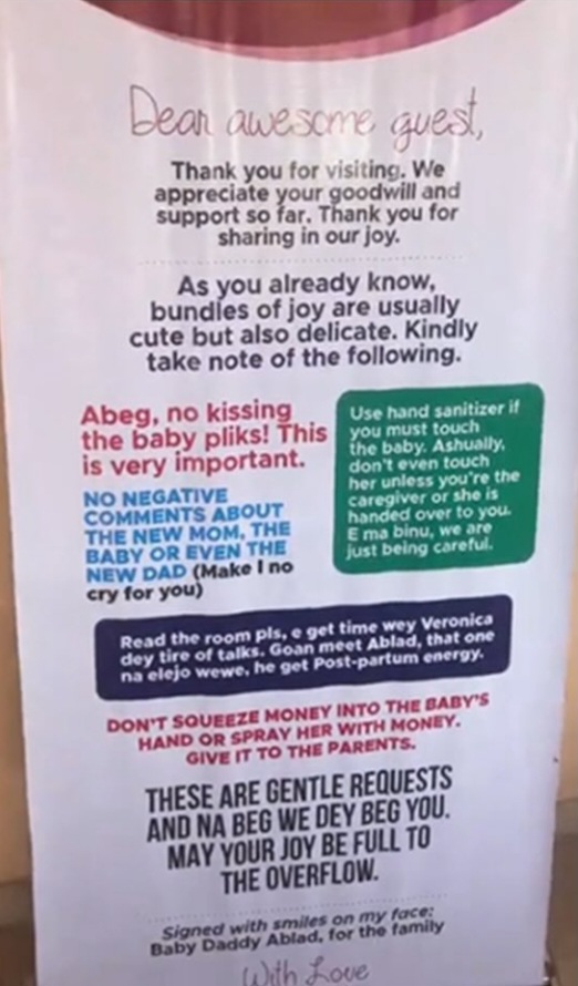 Woman reveals banner displayed by friend who gave birth