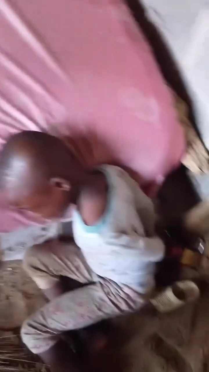 Outrage as mother ties her young son to a wooden column at home and goes out (video)