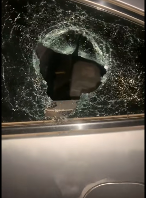 Side chick beats her married lover for refusing to sleep over, locks him up and smashes his car windows in Abuja (video)
