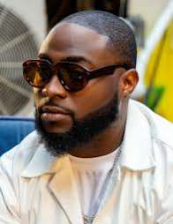 Singer Davido slams fan who dragged him while defending DJ Tunez