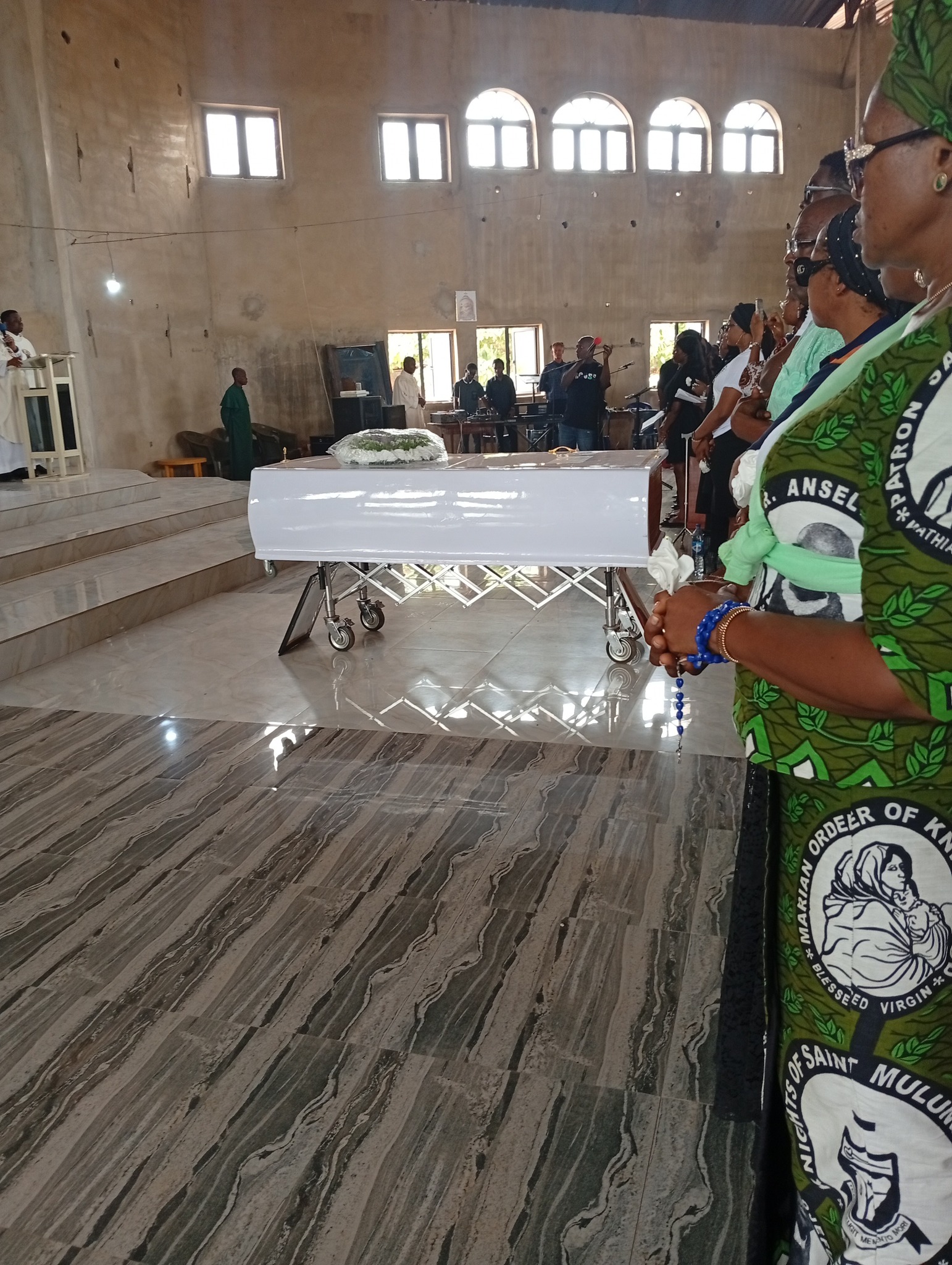 Singer bitten to de@th by snake in Abuja laid to rest (photos/video)