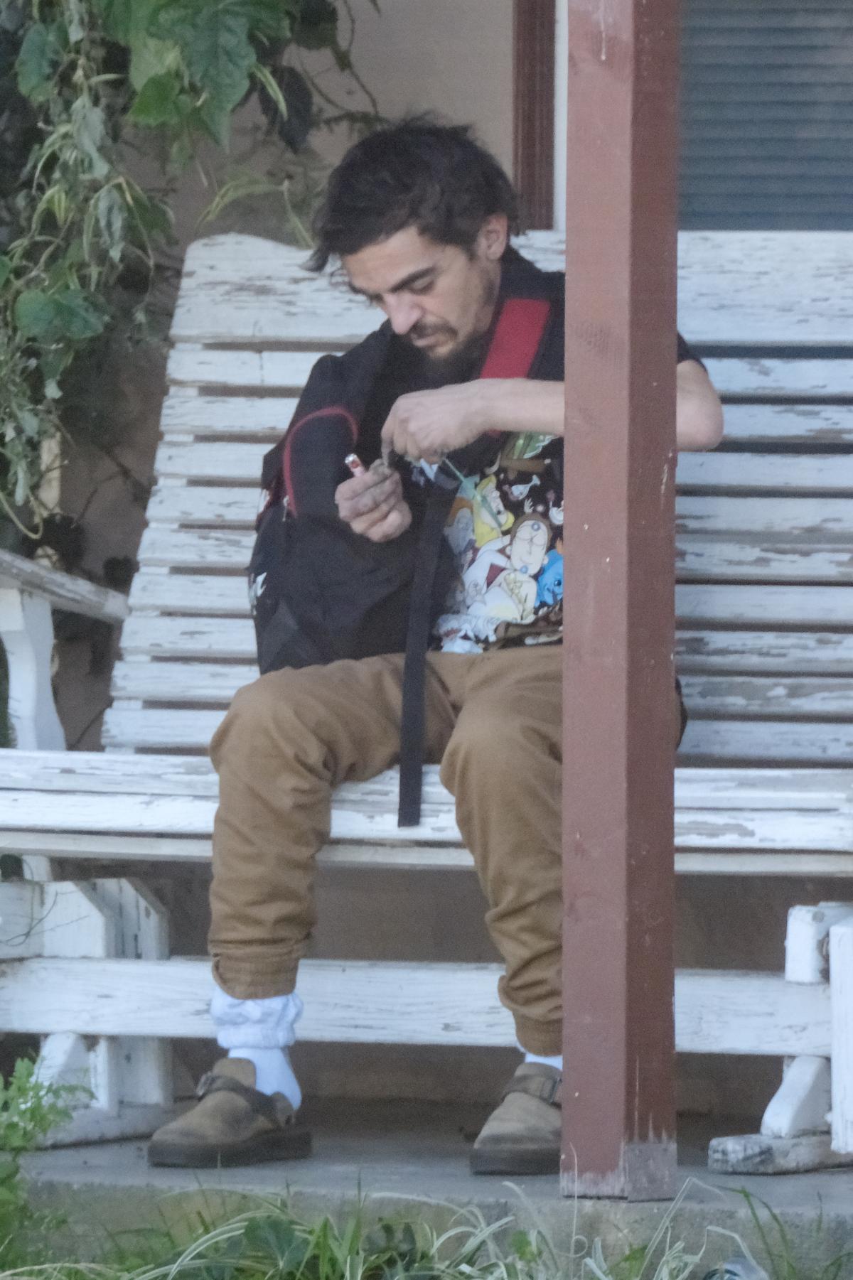 Former Nickelodeon child star Tylor Chase seen smoking and sleeping behind plank of wood weeks after being rescued from streets by former co-stars