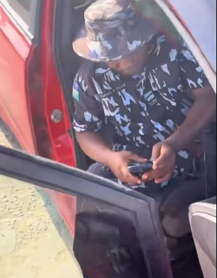 Screenshot from the viral video showing the confrontation between a Nigerian man and a police officer.