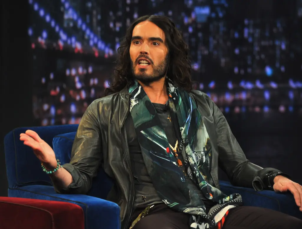 Woman who claims Russell Brand forcefully had his way with her says she begged him to stop